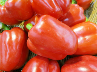 red bell peppers on a black background