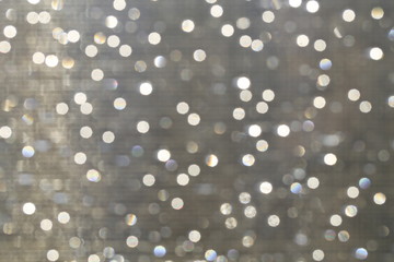 Glitter sparkling abstract bokeh defocused background, celebration