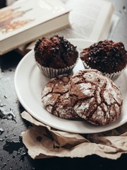 cookies and muffins on a small plate on the table