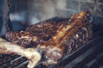 Patagonian lamb roasted on grill. Roasted leg of lamb. Argentine meat.