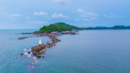 Aeril view of seascape of Chantaburi province, Thailand. Scenery consist of blue sea, blue sky with cloud, fisherman village along the bay.