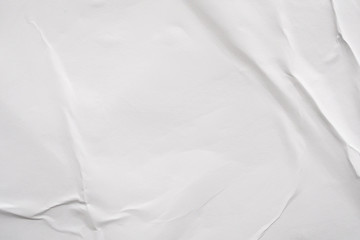 Blank white crumpled and creased paper poster texture background