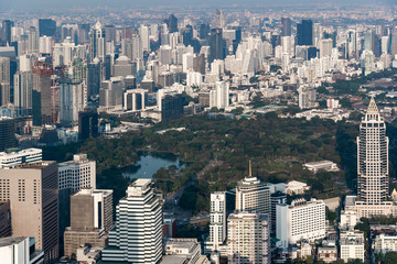 Landscape or Cityscape view of  the park is surrounded by many buildings in bangkok Thailand