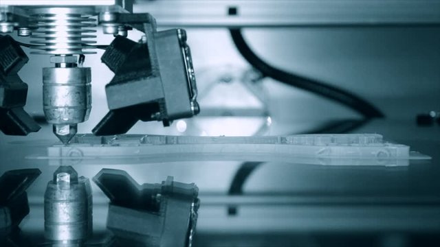 3D printer working. Fused deposition modeling