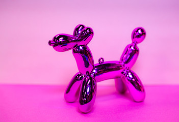 Shiny Pink Balloon Animal on a Two Tone Light and Dark Pink Background