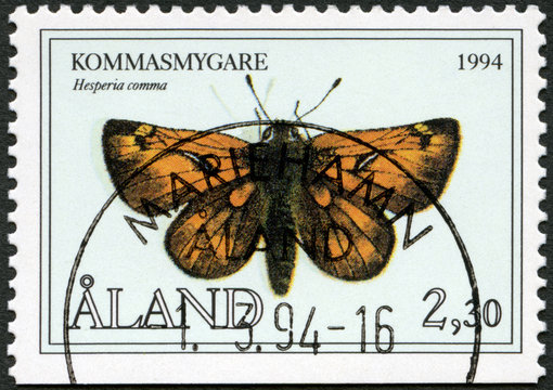 ALAND - CIRCA 1994: A stamp printed in Aland shows Hesperia comma, the silver spotted skipper, Butterflies, circa 1994