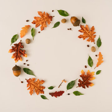 Creative season layout of colorful autumn leaves and branches. Nature mockup background. Seasonal concept. Flat lay wreath.
