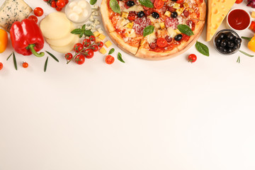 Flat lay. Pizza and ingredients: vegetables, cheese on white background, copy space