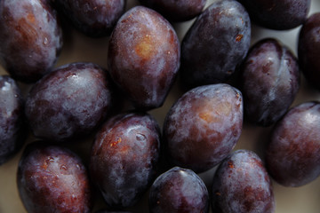 plums in wood plate