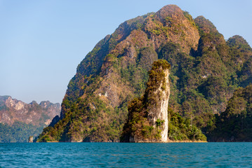Limestone mountains with trees in the sea in Thailand
