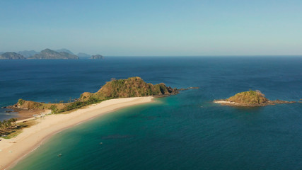 Naklejka na ściany i meble Wide sand beach Nacpan Beach, aerial view. El Nido, Palawan, Philippine Islands. Seascape with tropical beach and islands. Summer and travel vacation concept