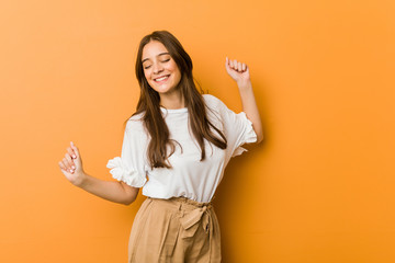 Young caucasian woman dancing and having fun.