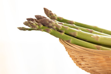 fresh green asparagus on white background