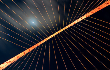 Fototapeta na wymiar Looking upwards at a suspended bridge
