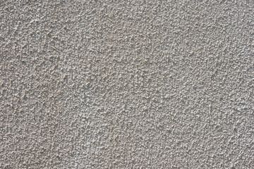 Texture of decorative plaster with a relief. White plaster. Close-up.