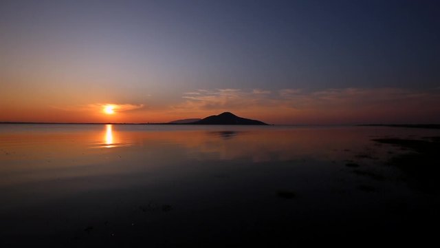 Sunset on the river. Nature river in sunset. Beautiful sunset in the nature in autumn. Autumn sunset in nature