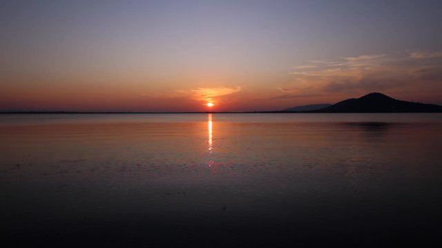 Sunset on the river. Nature river in sunset. Beautiful sunset in the nature in autumn. Autumn sunset in nature