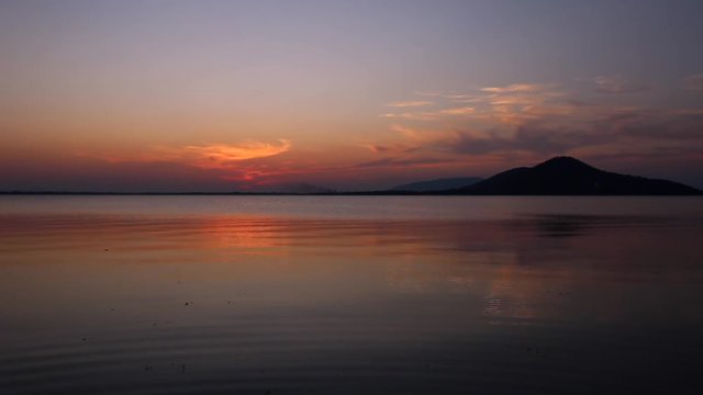 Sunset on the river. Nature river in sunset. Beautiful sunset in the nature in autumn. Autumn sunset in nature