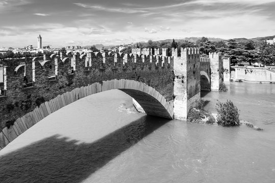 Medieval brigde over river in Verona - black and white photo
