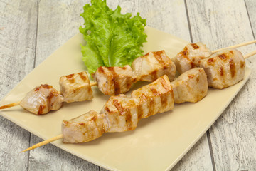 Grilled pork skewer served salad