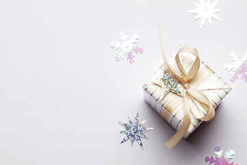 Christmas and New Year's Day. Gift box with a ribbon and a bow  on white background. Spase for text.