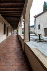 Obraz premium The abbey of Santa Maria in the village of Follina / Trevigiani hills