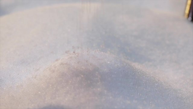 Polypropylene granules fall in slow motion. Polypropylene granular raw materials