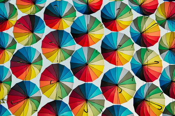 Colored raindow unbrellas pattern texture background.
