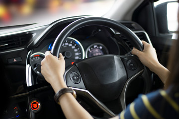Fototapeta na wymiar woman driving car hand on steering
