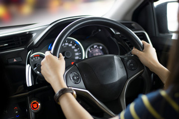 woman driving car hand on steering