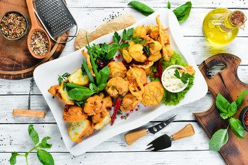 The vegetables are deep-fried. Restaurant dishes. Top view. Free space for your text.