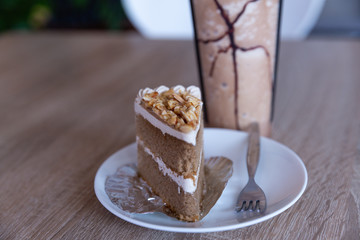 Almond Coffee Cake with vanilla latte on wood table 