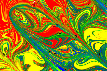Multicolored abstract background pattern created with red, yellow, blue and green liquid paint swirls