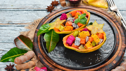 Papaya. Tropical Fruit Salad. Top view. Free space for text.