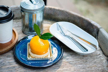Orange Mousse Cake on Wood Table
