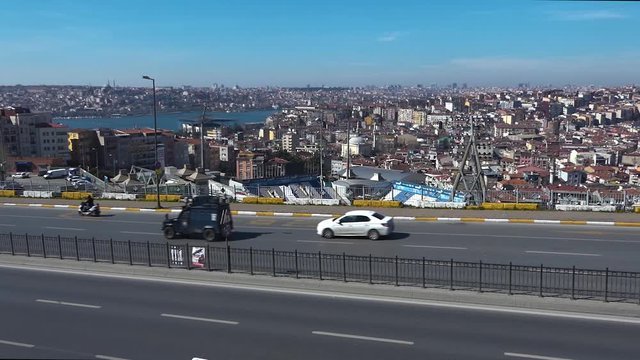 Istanbul city street with fast passing regular urban cars and special army or police vehicles. Full HD stock footage clip on Turkish life, history, travel, culture, econimics, politics. 
