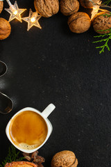 Obraz na płótnie Canvas coffee, New Year, Christmas background or Noel holiday festive (nuts, cones, specials, decorations and gifts on the table, greeting card) winter menu concept. food background. copy space. Top view