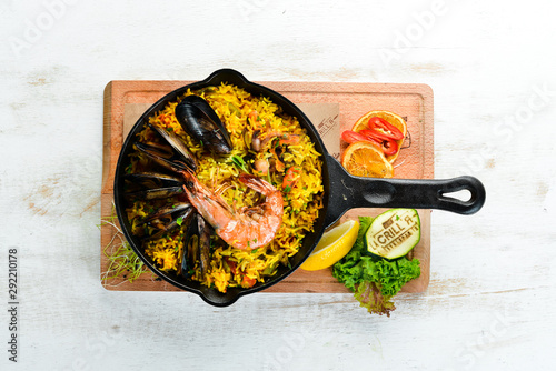Seafood rice. Paella with mussels and shrimp. Top view. Free space for your text.