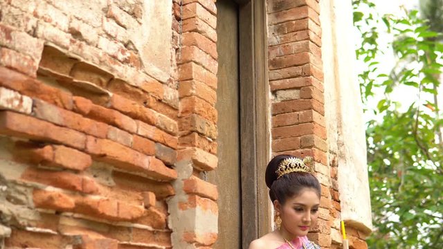Portrait of beautiful asian woman in Thai dress traditional praying hold kratong for join loy kratong festival at thailand