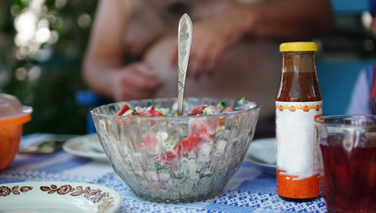 Healthy and tasty meals on the dining table. Cucumber and tomato salad