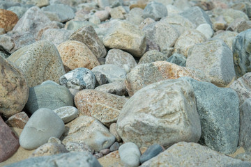 Stones in different sizes, forms and colors. Summertime in Sweden.