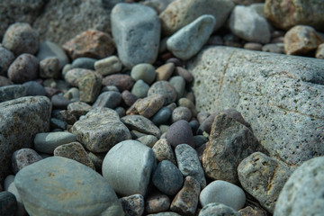 Stones in different sizes, forms and colors. Summertime in Sweden.