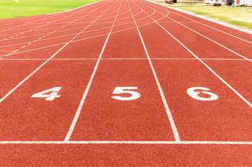 Start or finish position on running line track rubber lanes in the sport stadium.