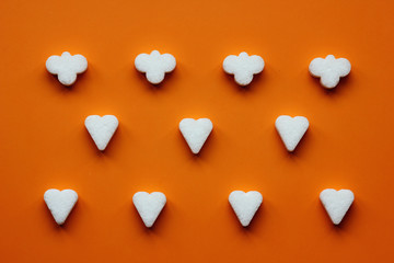 sugar figures in the shape of hearts and clouds lined up in a row