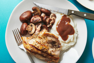 Grilled Chicken and Mushrooms with Mashed Potatoes on Blue
