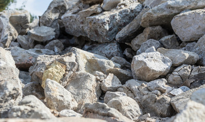 Fototapeta na wymiar Demolition garbage large rocks. Stones, construction waste.