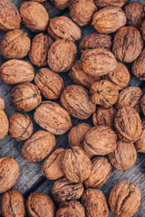 Walnuts close-up on a wooden background.