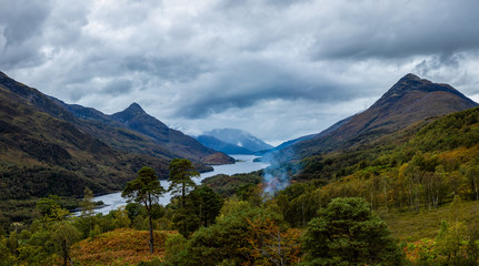 a high viewpoint over loch leven in the argyll region of scotland near kinlochleven and fort william on the west highland way showing loch waters and cloudy skies in autumn