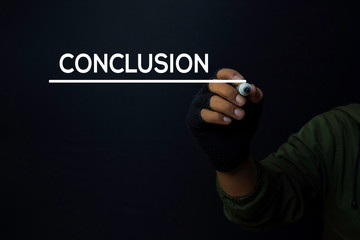 A man write a conclusion with a black background