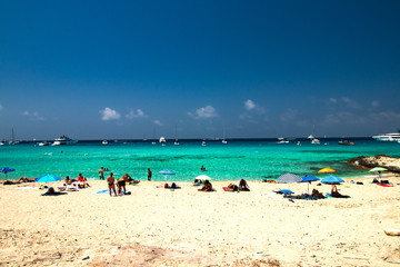 Fototapeta na wymiar beach with umbrellas and sunbeds from island formentera